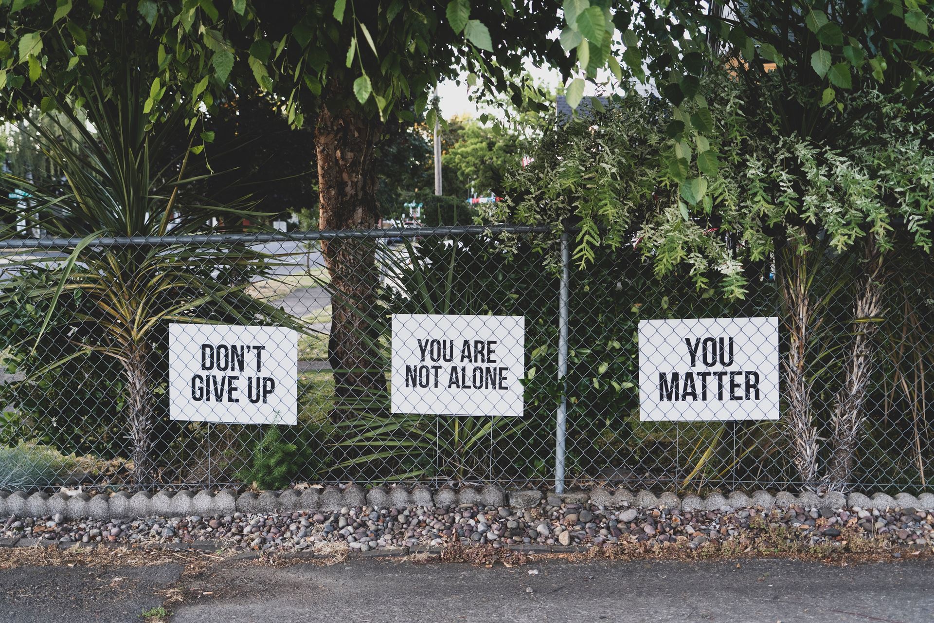 a sign on the side of the street