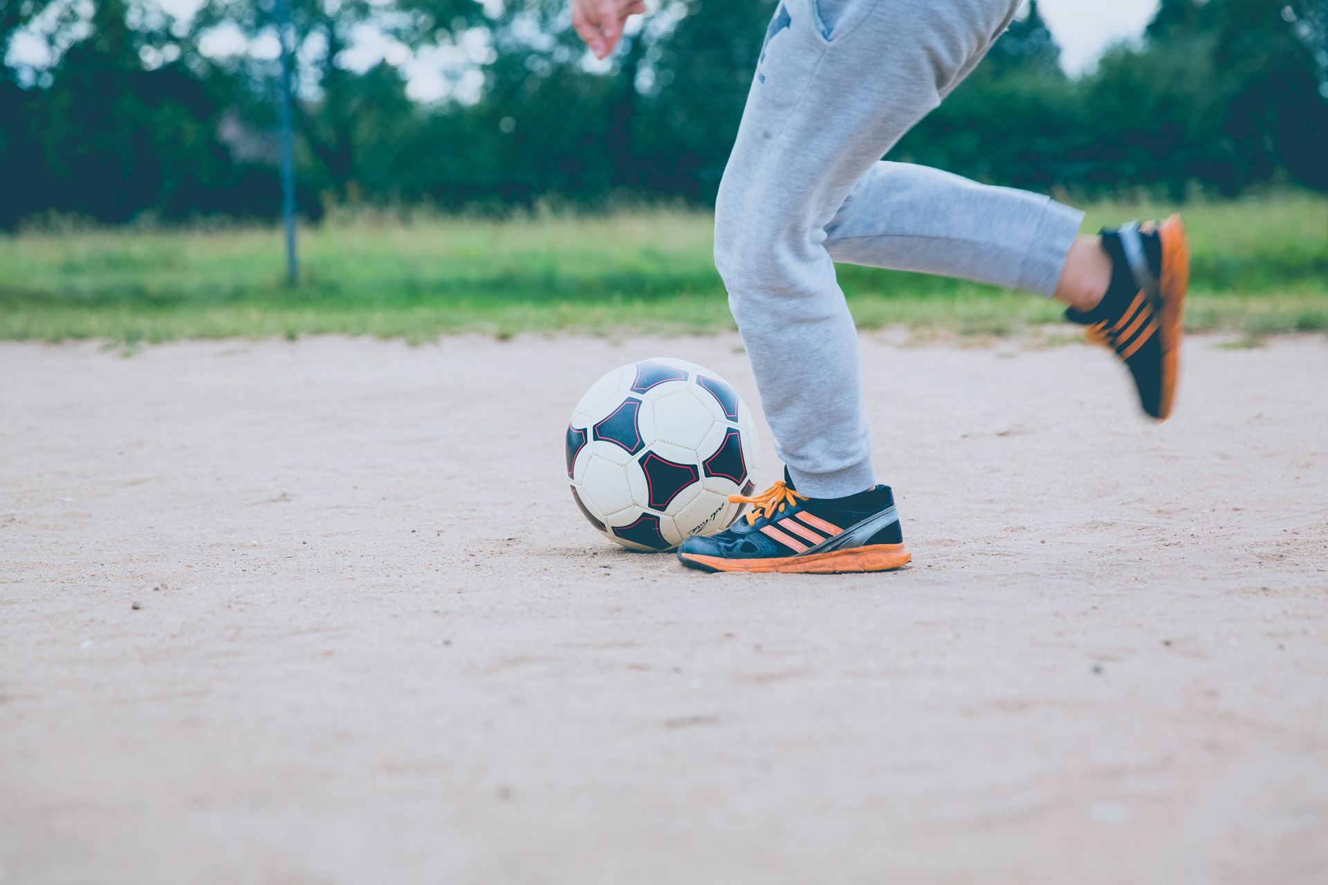 a close up of a person throwing a baseball