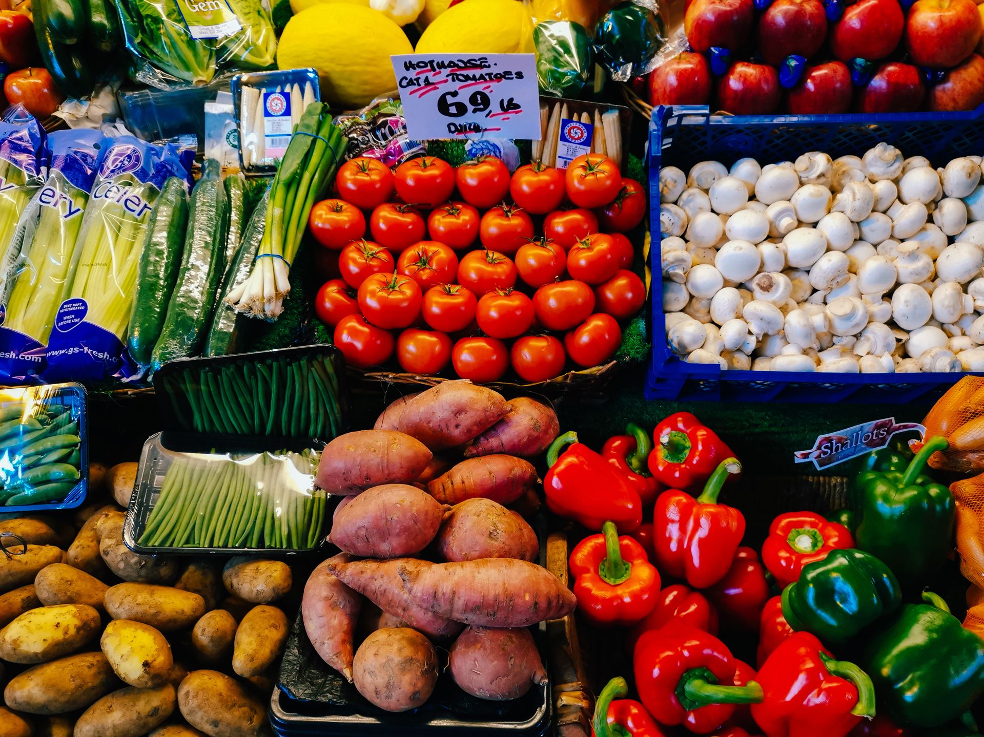 a group of fruit and vegetables on display